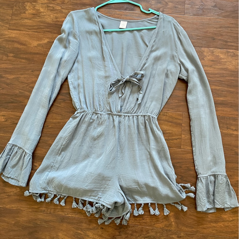 Light blue long sleeve romper by “ále by Alessandra”